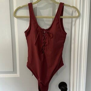 Ribbed, tie front one piece suit